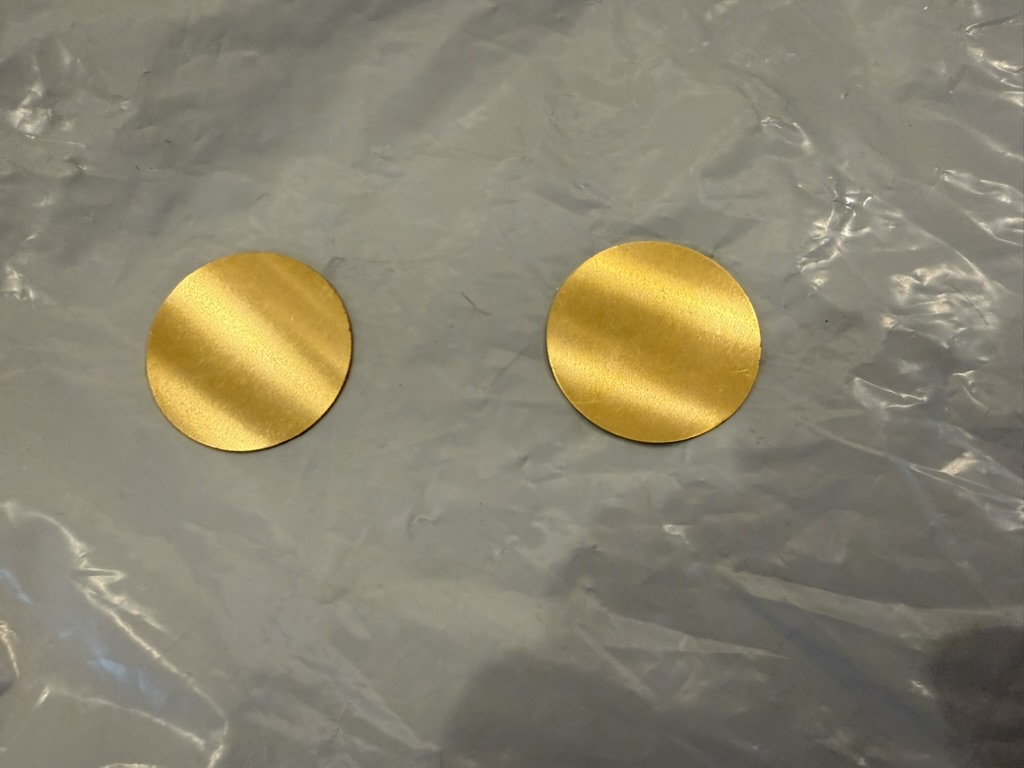 Two raw blank dials, before any hand-finishing.