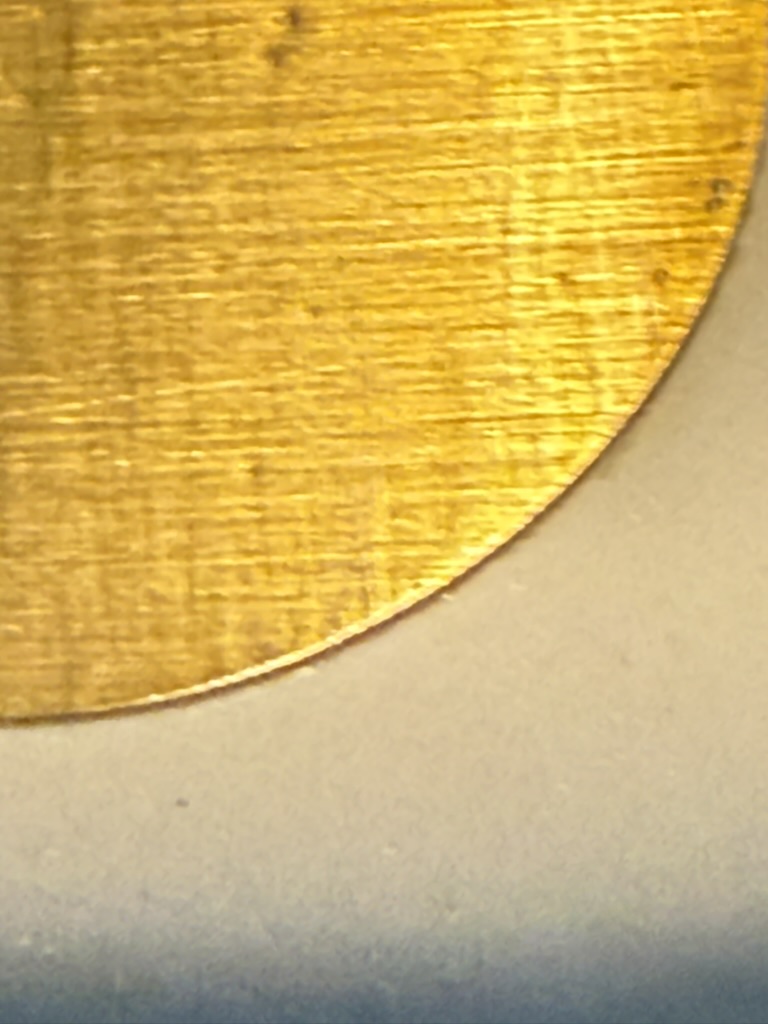 Close up on the cream-lacquer dial, showing the bubbling that made this attempt a miss.