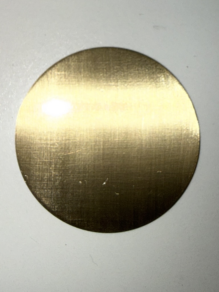 The first dial from that first experiment. From a distance, the linen texture is still faint — barely visible.