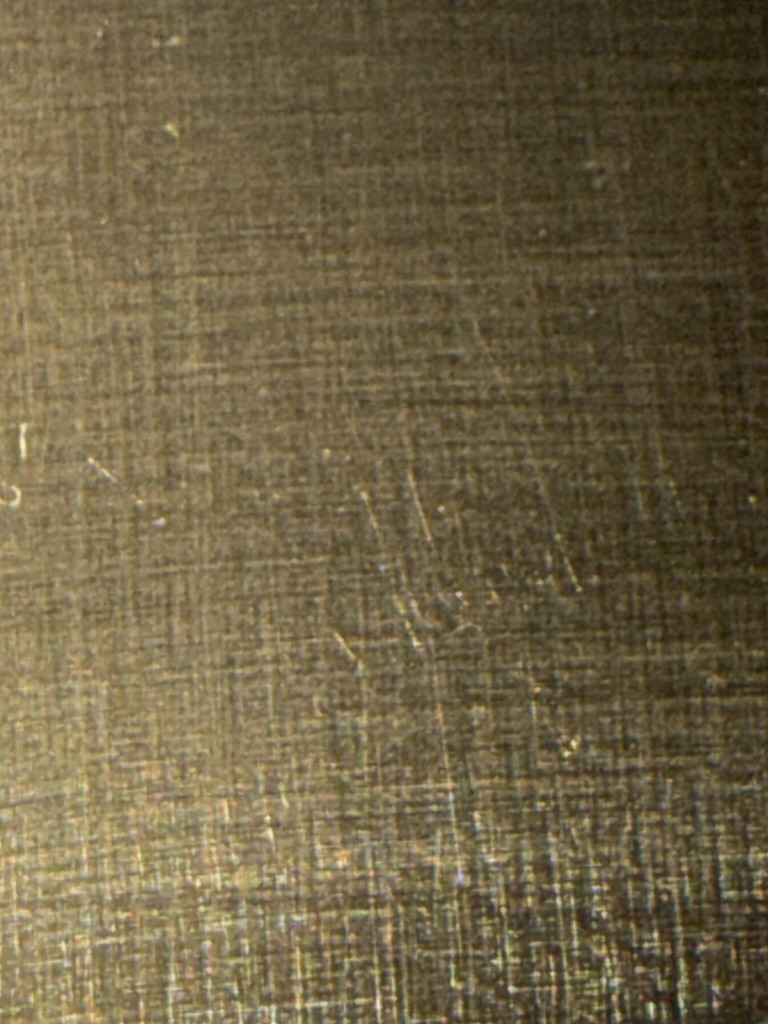 The same dial, magnified. Up close you can see more of the woven grain I'm starting to form by hand.